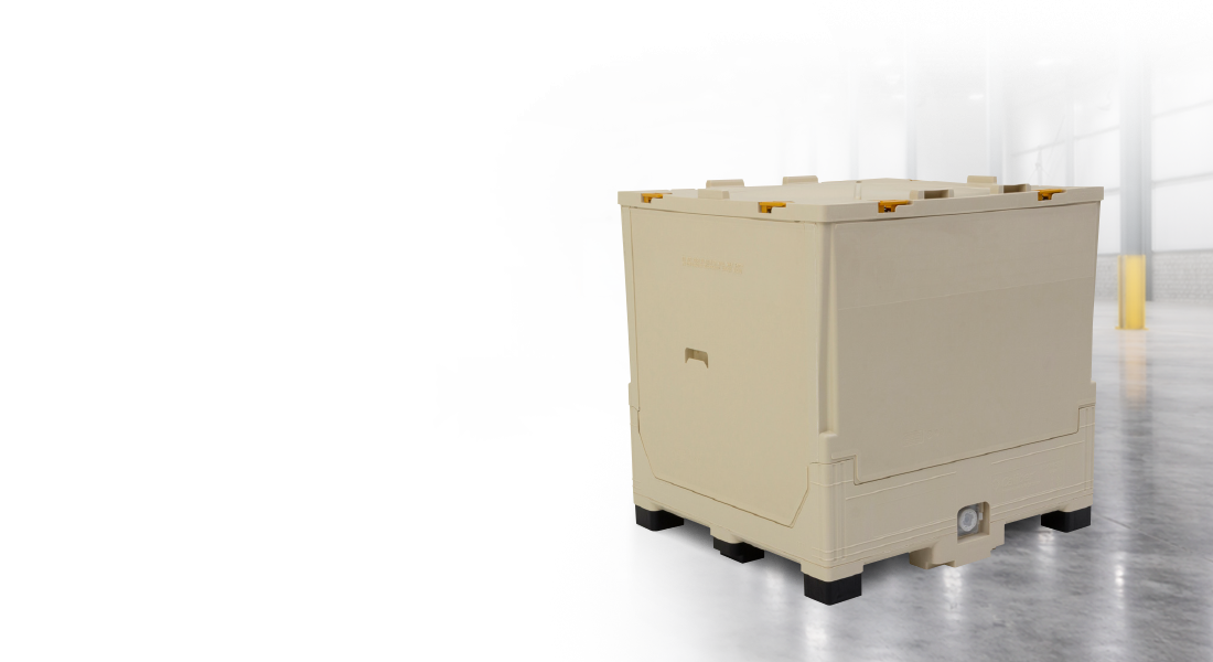 A large beige storage container with reinforced edges stands on a polished warehouse floor. The background is dimly lit, creating a dramatic contrast.