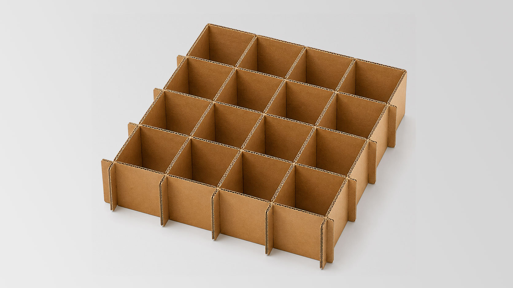 Brown cardboard grid divider with 16 square compartments on a light gray background.