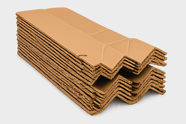 A stack of corrugated cardboard pieces with visible zigzag edges.