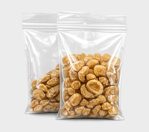 Two resealable plastic bags filled with light brown nuts.