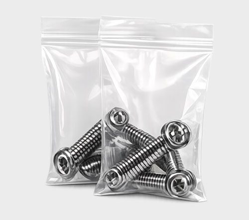 Two clear plastic bags containing shiny metal screws.