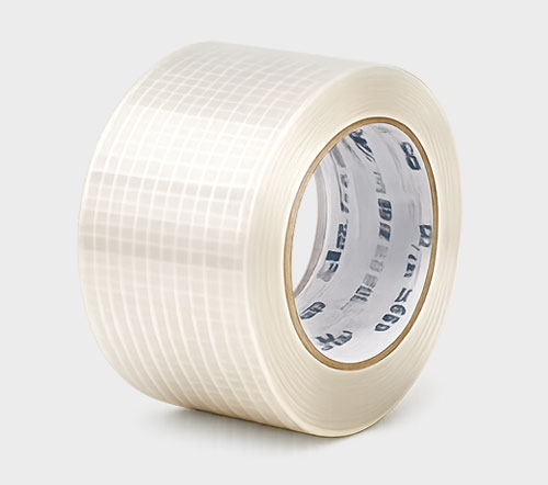 A roll of clear packing tape with a grid pattern on its surface.