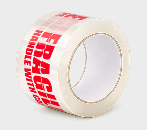 A roll of clear packing tape with red text "FRAGILE HANDLE WITH CARE" printed on it.