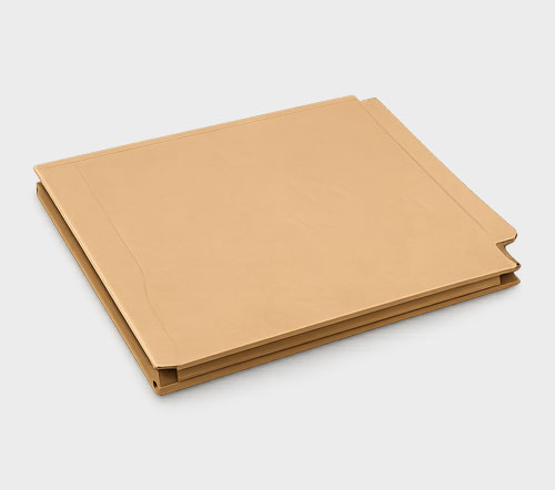 Closed tan file folder against a gray background.