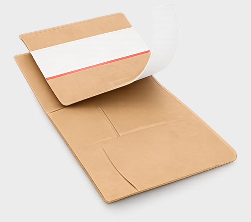 Beige cardboard mailing envelope with an adhesive strip and red line.
