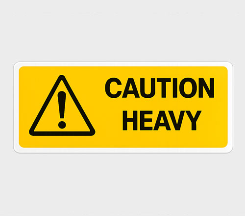 Warning Labels Yellow caution sign with exclamation mark and the words "CAUTION HEAVY."