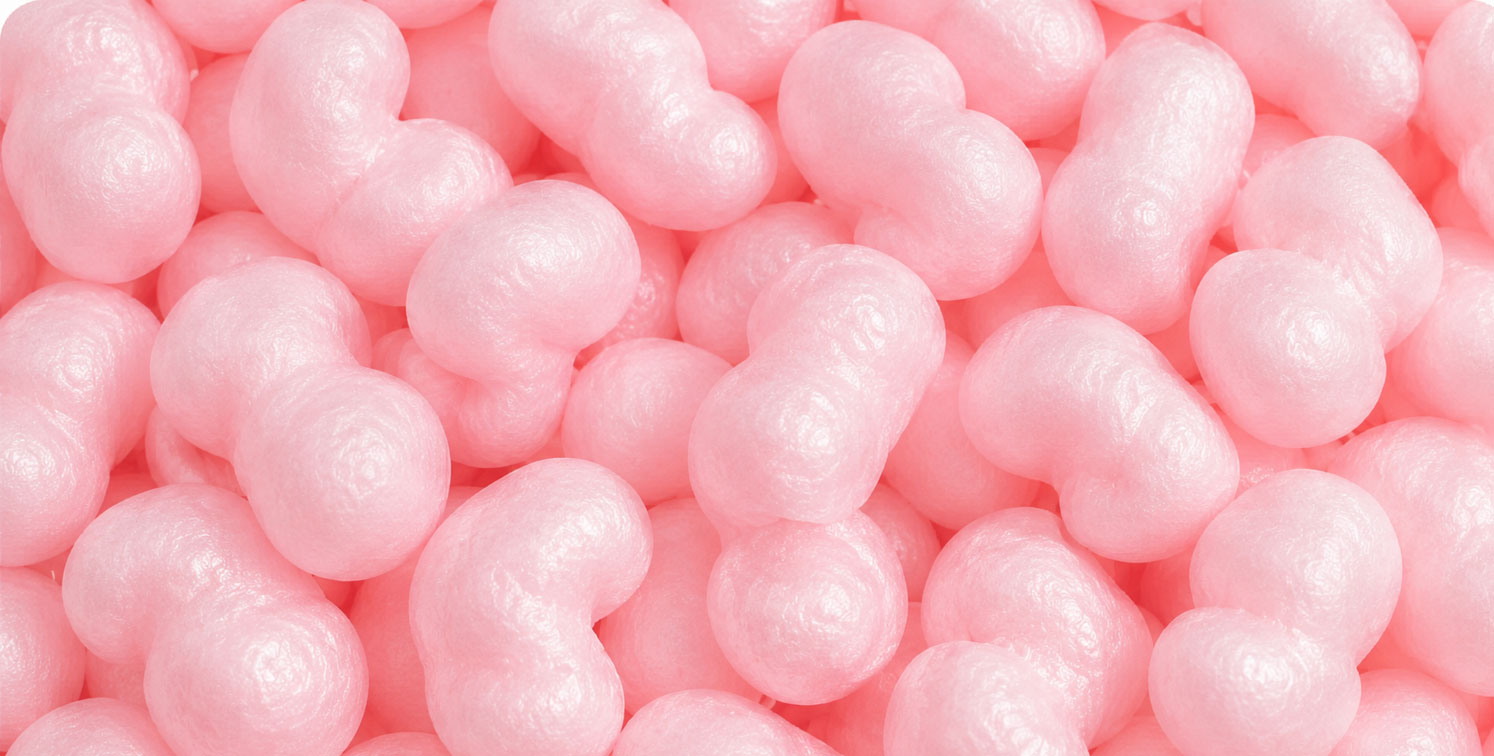 Close-up of pink packing peanuts in a dense arrangement.