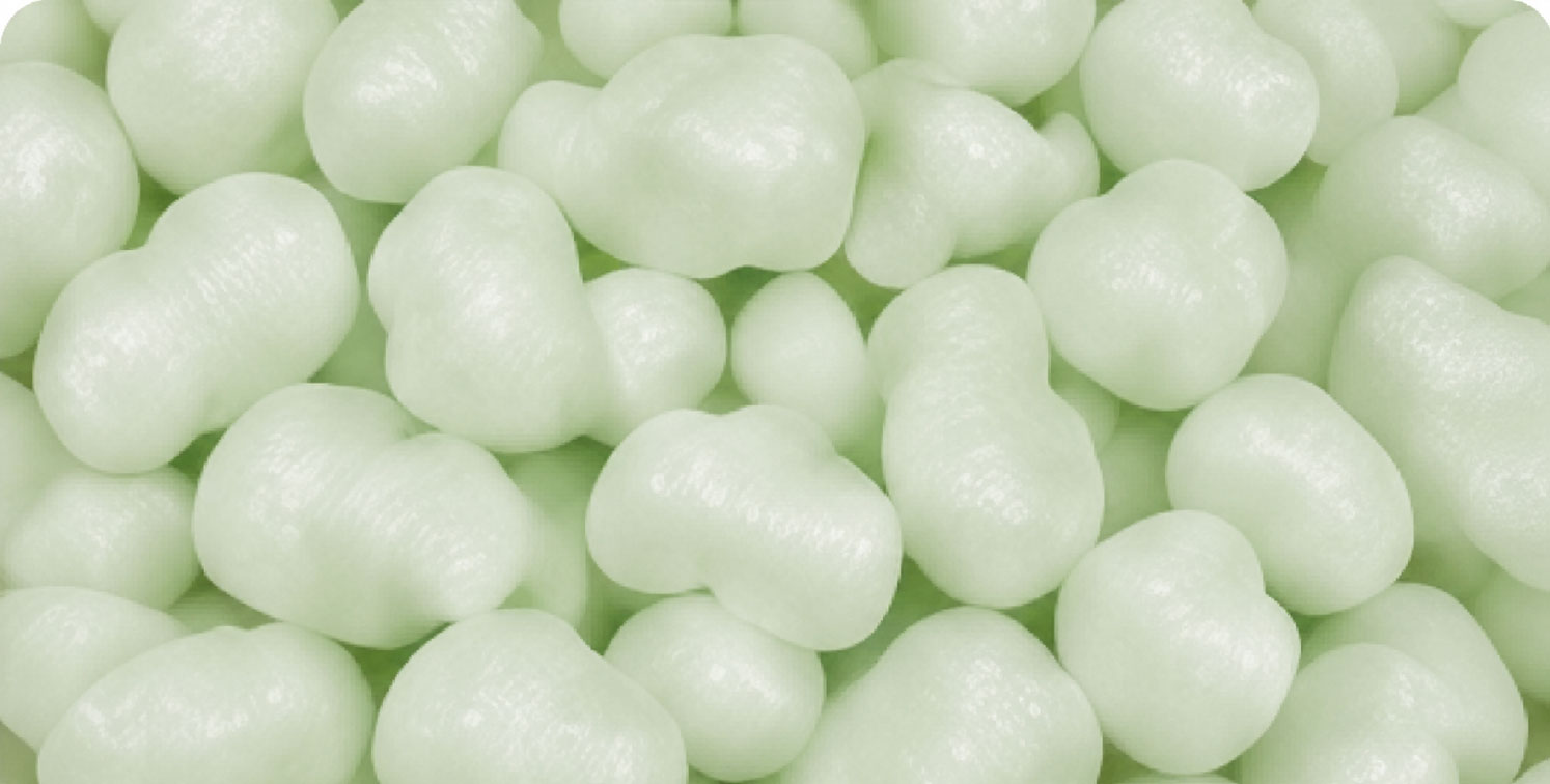 Close-up of light green packing peanuts.