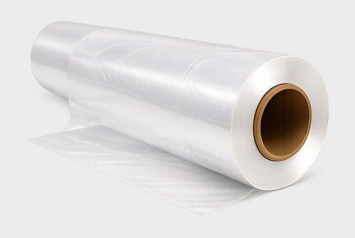 A roll of transparent plastic film with a brown cardboard core, partially unrolled.