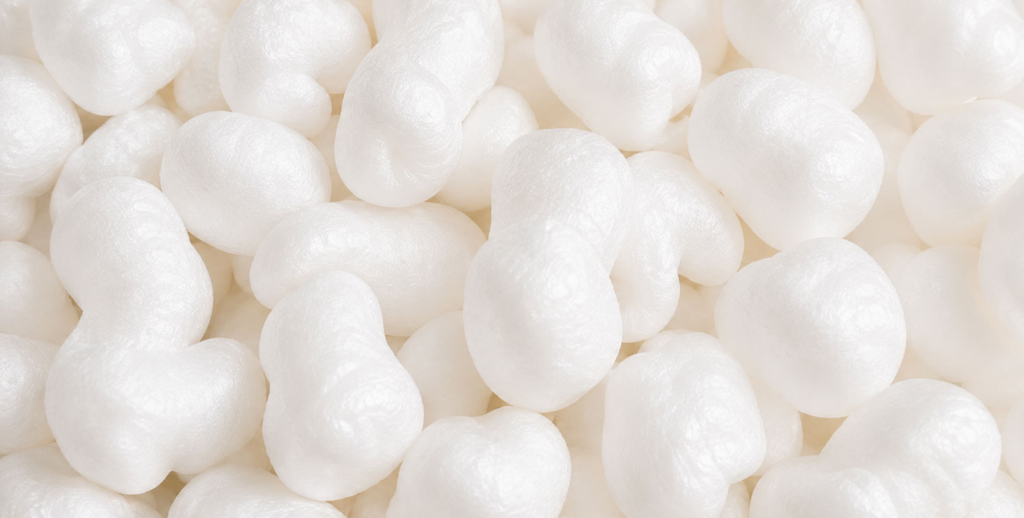 Close-up of white packing peanuts clustered together.