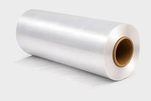A large roll of clear plastic film on a light gray background.